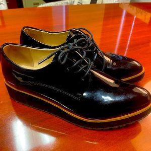 Perfect condition black patent leather saddles.